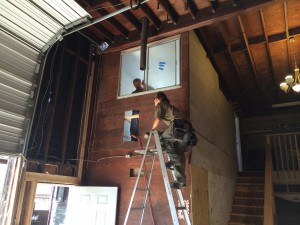 Richard assists Natural in framing the interior window for laser lab.