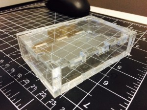 Laser cut box made out of quarter-inch acrylic using a design generated by http://boxmaker.rahulbotics.com