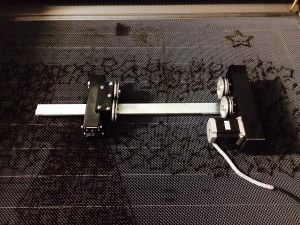 Rotary adapter for engraving cylindrical objects on the laser.