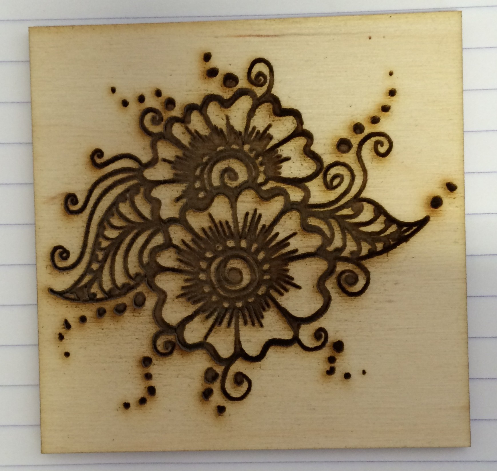 Henna pattern engraved on plywood